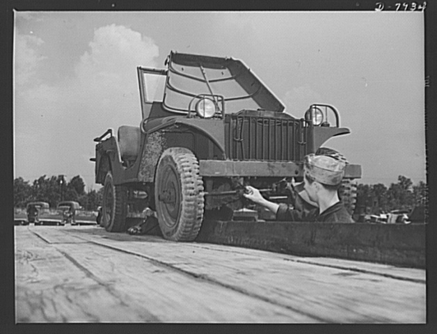 GI in the grease pit servicing a jeep