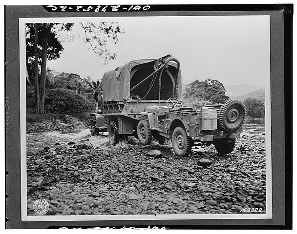 Jeep being towed by two and a half ton truck