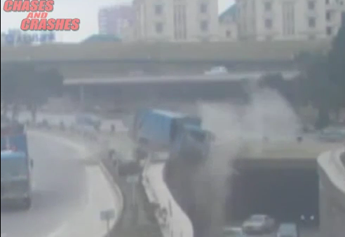 Watch An Out of Control Truck Plummet Off an Overpass and Nearly Squash Passing Traffic in Azerbaijan