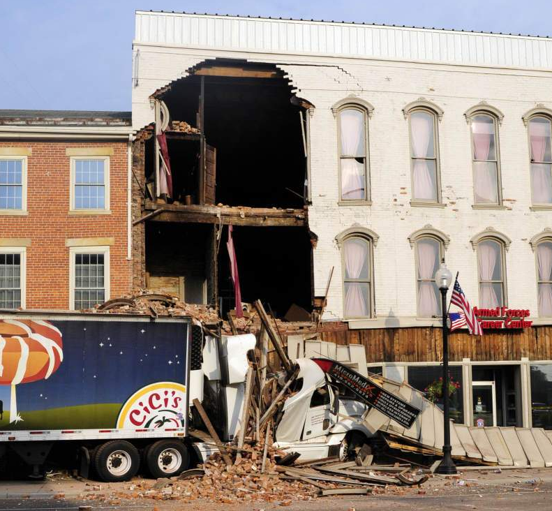 Video: Big Rig Crashes into Cool Old Building: Building Fights Back When Truck Is Removed!