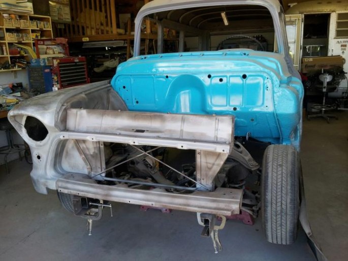 "Now I'm working on the front end. I'm putting on some '56 fenders I had off another parts truck. They're decent fenders, one needs a lower rear corner, they both need some rust repair near the top rear retaining bolt (strange but common rust spot). The old fenders off the '57 were mostly rust free, but were hammered really bad at the top front, so they're not really usable except as patch panel donors. I got the front frame horns figured out, I'm mocking up the front end to make sure they're right before welding them on this time."