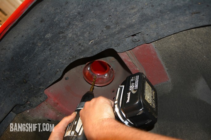 Dave starts drilling out the spot welds to remove the strut cup. 