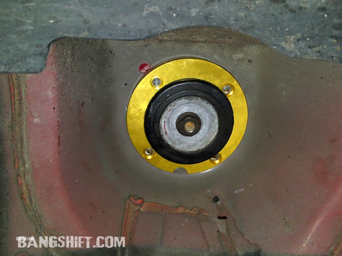 The camber plate blank is indexed and held in place by the clamp made from takeoff GTO parts.