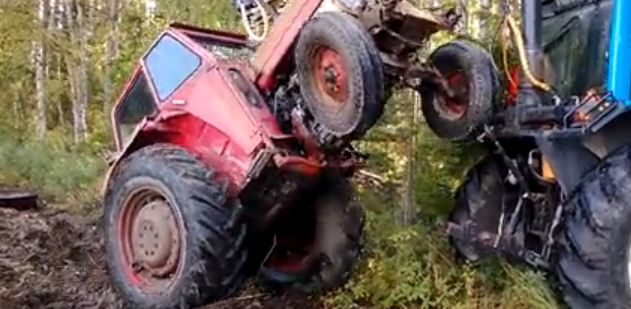 Russian Fail Video: How Not To Pull A Stuck Tractor Out Of The Mud