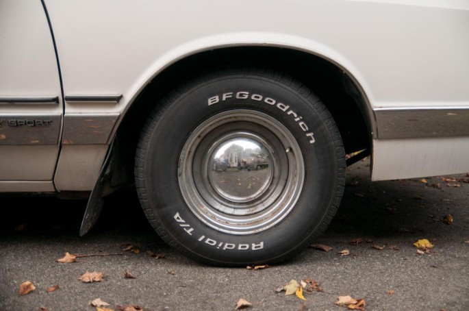 A set of 225/60/14s mounted on rusty chrome smoothies finishes our tour of the exterior. These will be replaced soon with another set of period-correct GM wheels.