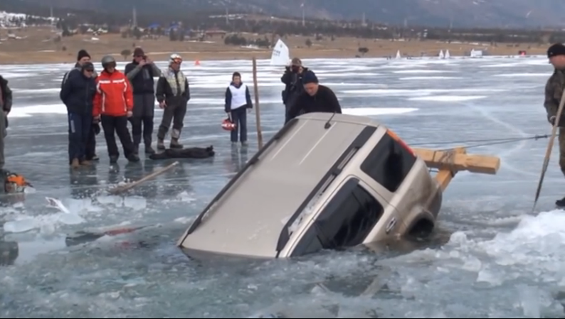 More Frozen Turkey: Watch Russian Guys Drag A Sunken SUV Out Of A Frozen Lake With Logs, Rope, And Human Power!