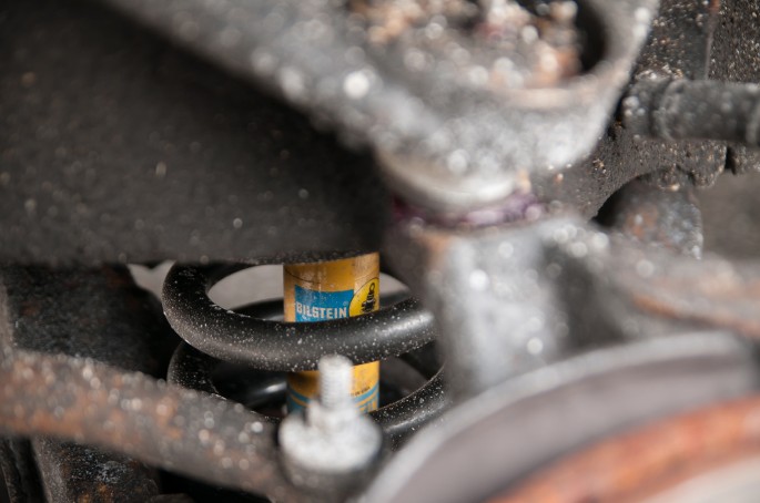 Shot of the Bilstein shock and Eibach spring installed. As the Eibach springs are much shorter than the stock springs, they went in easily without a spring compressor.