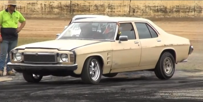 Watch This Old Holden Suffer Some Super Gnarly Axle Hop While Trying To Get A Burnout Going – Slow Motion Violence!