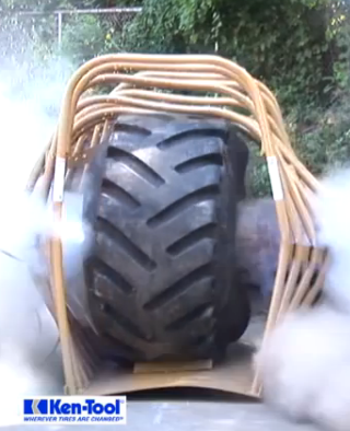 Watch A Giant Tractor Tire Get Overinflated An Explode On Purpose In An Industrial Strength Tire Cage