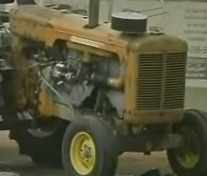Watch An Old Minneapolis Moline Pulling Tractor Launch Parts And Completely Puke Its Guts Out During A Pull!