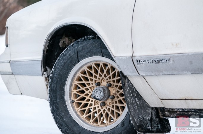 The wheels themselves are 15" thirdgen Firebird SE wheels wrapped in 215/65/15 Blizzak WS60s.