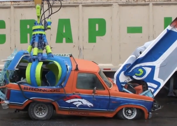 This Seattle Scrap Yard Painted Their Shear and Grapple Up Like A Seahawk And Used It To Eat A Bronco