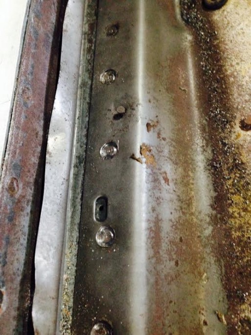 Here you can see some drilled spot welds. Kevin said that it is important to pay attention to how deep you are plunging the tool A screw driver becomes a good tool to see if stuff is free or if more drilling is required. 