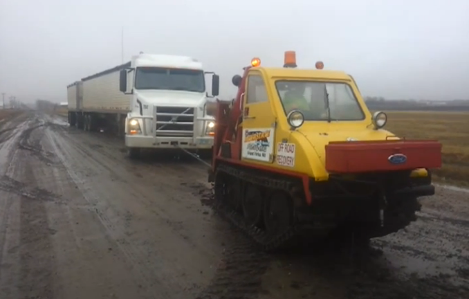 This Video Of A Bombardier Sidewalk Plow Pulling A Big Rig Out Of The Mud Is Totally Awesome