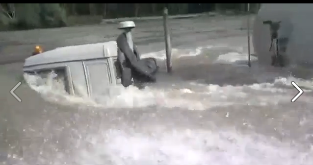 WTF Video: Please, Please, Please Help Us Figure Out Why This Virtually Submerged Big Rig Is Driving Down A River