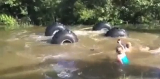 Watch The Old “Float Your Monster Truck Down The River Trick” End As Badly As It Usually Does – Swearing At No Extra Charge