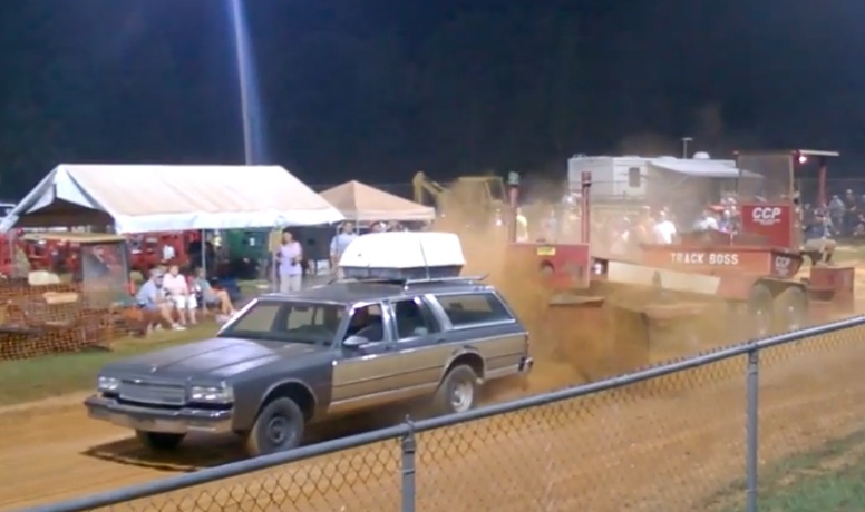 That Is A Caprice Wagon Hooked To A Pulling Sled – Video Of It In Action Here!