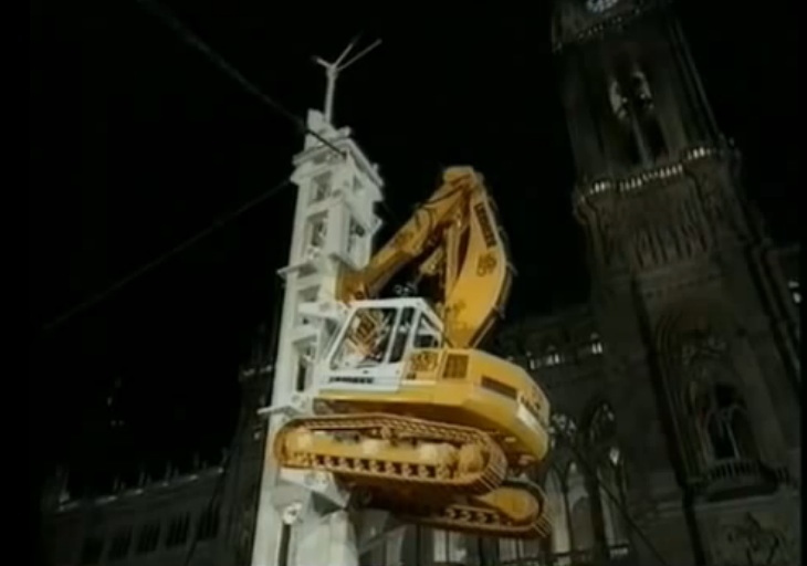 Watch This Excavator Climb To The Top Of A Specially Made Tower – Huge Skills Involved Here!