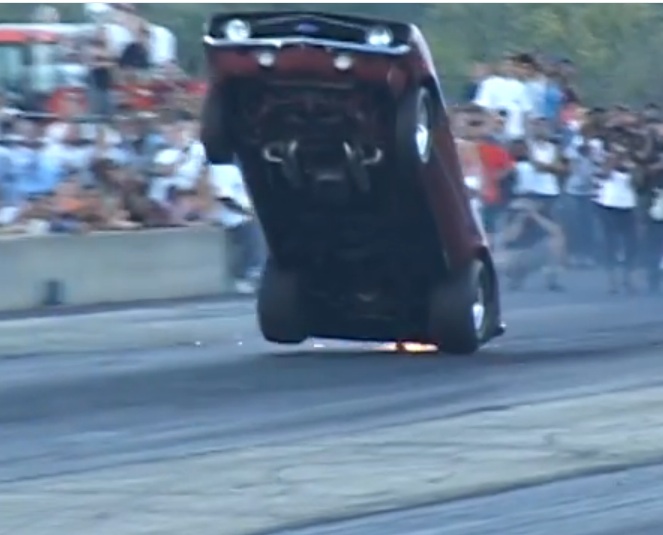 Watch A 1969 Camaro With A Nitrous Bottle Strapped In The Passenger Seat And The Hose Jammed in The Carb Pull Two MONSTER Wheelies