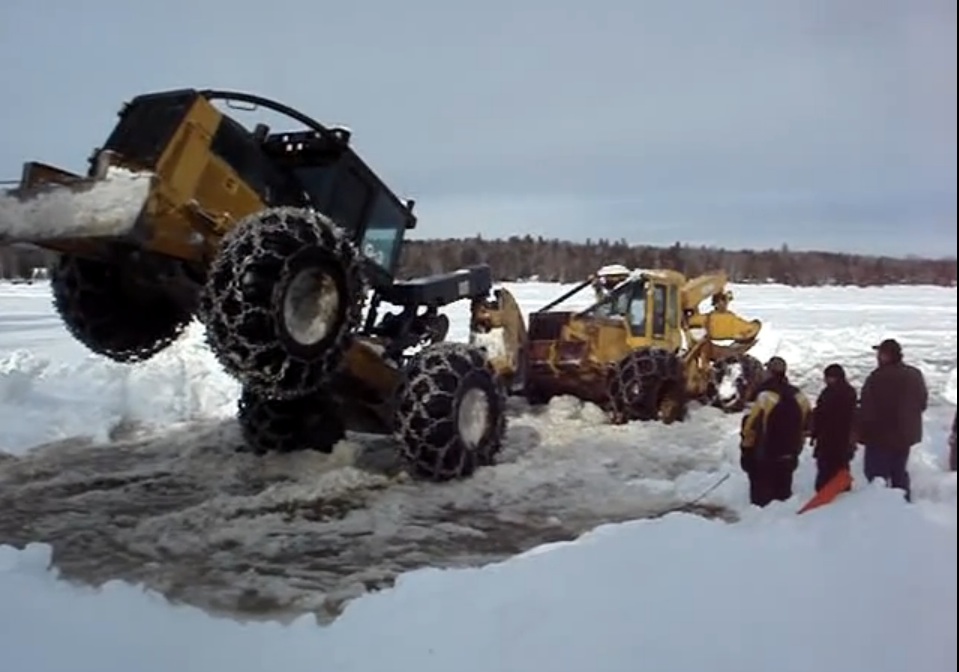 Leverage And Torque Rule: Watch This Log Skidder Operator Save Another Machine From A Frozen Lake In Maine