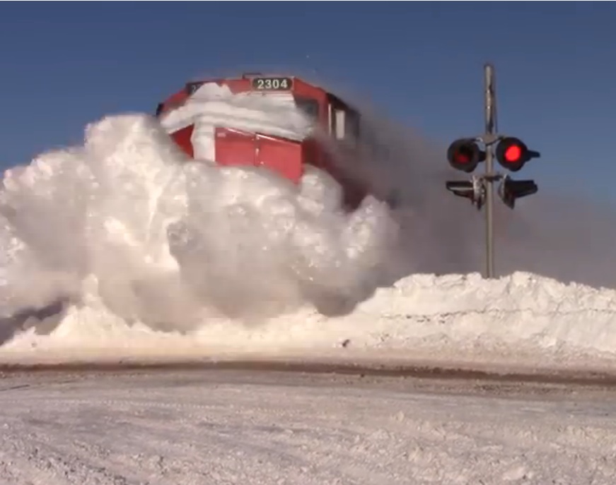 Duck And Cover Video: This Snow Blasting Train Won’t Be Stopped And The Camera Man Gets BLASTED!