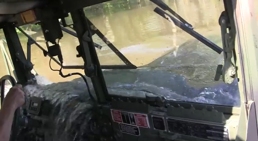 Watch This Huge Deuce And A Half Truck Drive Through What Looks Like A 6ft Deep Swamp…With A Twist