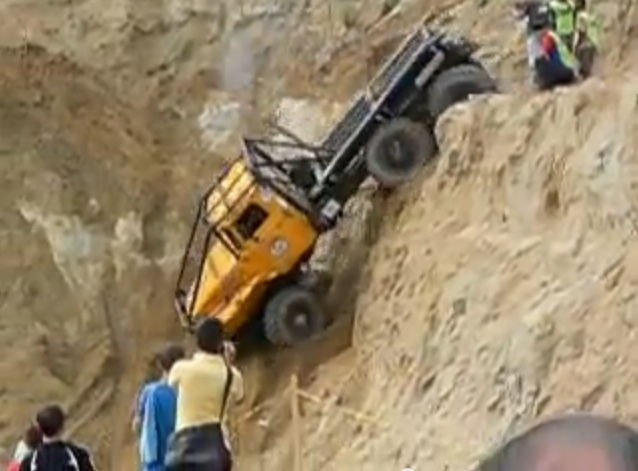 Watch This Huge Truck Drive Off A Sandy Cliff And Carry On Like No Big Thing