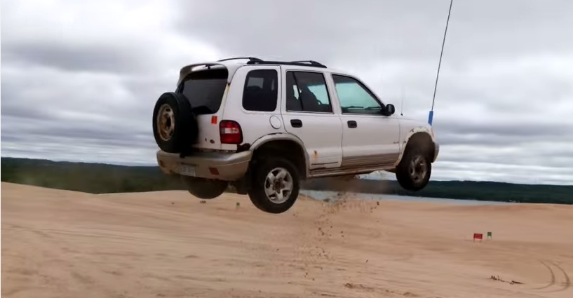 Sand Dune Jumping Part 2: Watch This Beater Kia Own The Air!