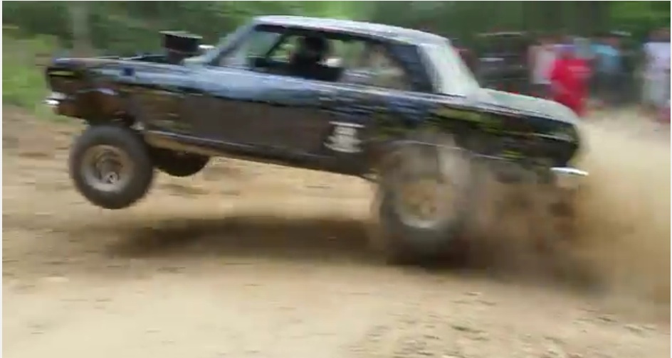 Watch This Crazed Off-Road Nova Scream Up A Hill Climb While Catching Air – Who Is This Masked Man?!