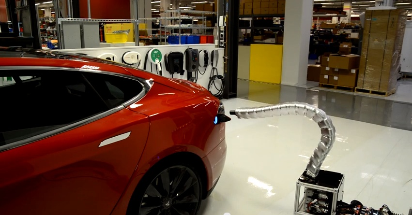 Caption This: Tesla Has A New Snake-Like Charger That Finds The Car’s Charging Port Like A…Uh, Well…