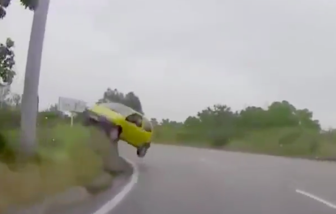 He Stuck The Landing! Watch This Tiny Car Lose Grip On The Highway And End Up High and Dry