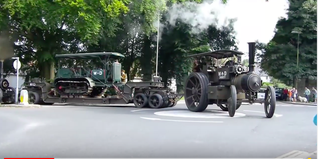 Best of 2018: Watch This Steam Tractor Pull A Lowboy Trailer With A Crawler Tractor On It Through An Intersection!