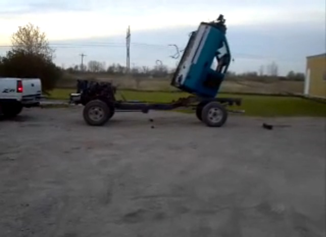 Using Two Pickup Trucks To Tear The Cab Off A Third Truck May Be Crude, But Wow Is It Effective!