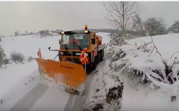 This Close Encounter Between A Bicyclist And A Snow Plow Results In Swearing – You Make The Call!