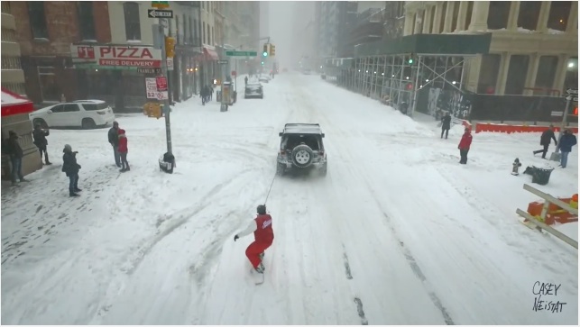 Snow Got You Down? Watch This Snowboarder Get Towed Behind A Jeep And Cheer Right Up!