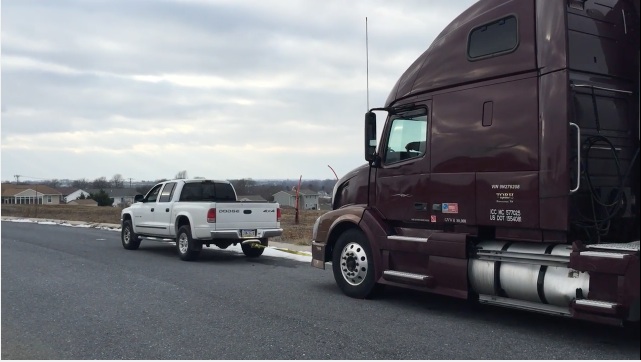 Watch This Dodge Dakota Drag A Volvo Tractor To Bump-Start It After The Starter Goes Out!