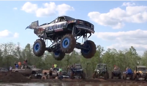 Cleared For Takeoff: Watch These Two Mega Trucks Jump Into The Water At The Louisana Mudfest!