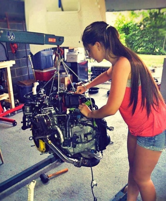 girl working on engine