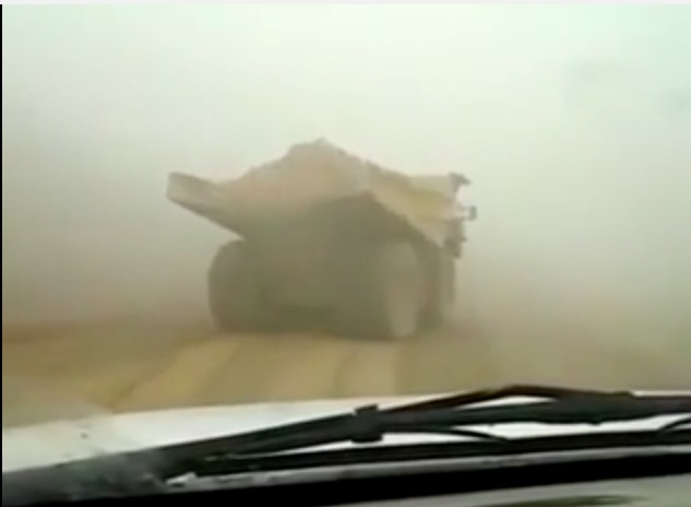 Pucker Up! Watch This Massive and Loaded Mining Haul Truck Spin Out On A Slippery Road