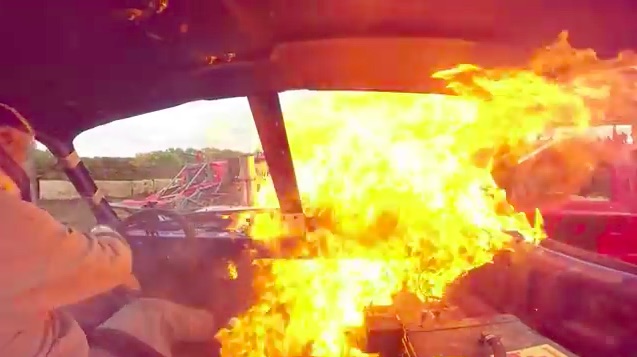 KABOOM! Watch This Demolition Derby Driver Bail Quick When His Has A Flaming Transmission Explosion