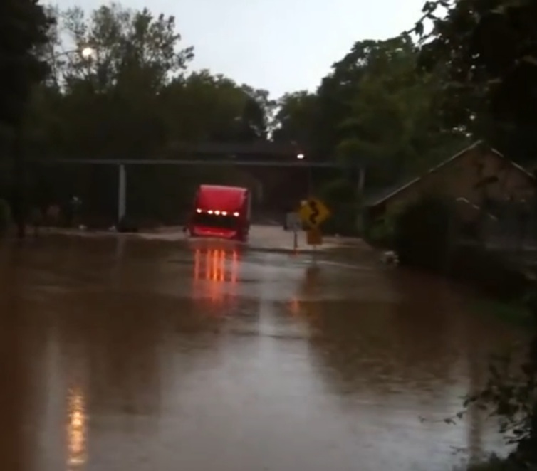 Calculated Risk Or The Luckiest Trucker In America? Watch This Rig Plow Through Water Up To Its Windshield!