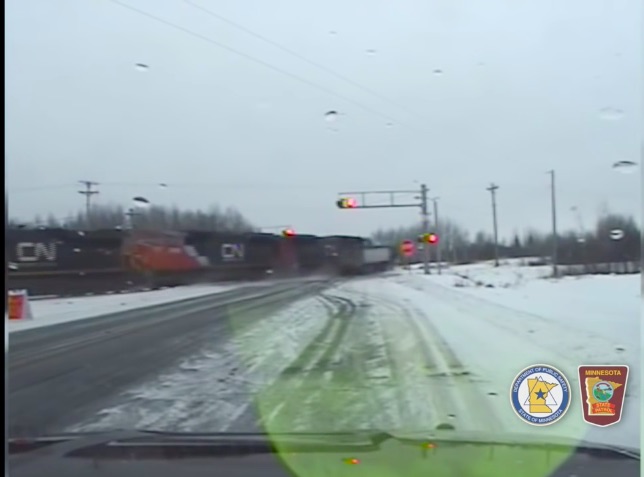 Watch A Truck Driver Pull Away From A Traffic Stop And Directly Into The Path Of An Oncoming Train! (everyone ok)