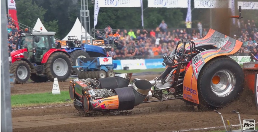 Hard Hit Video: Watch A Pulling Tractor Driver Get Beat Around So Bad His Helmet Flies Off!