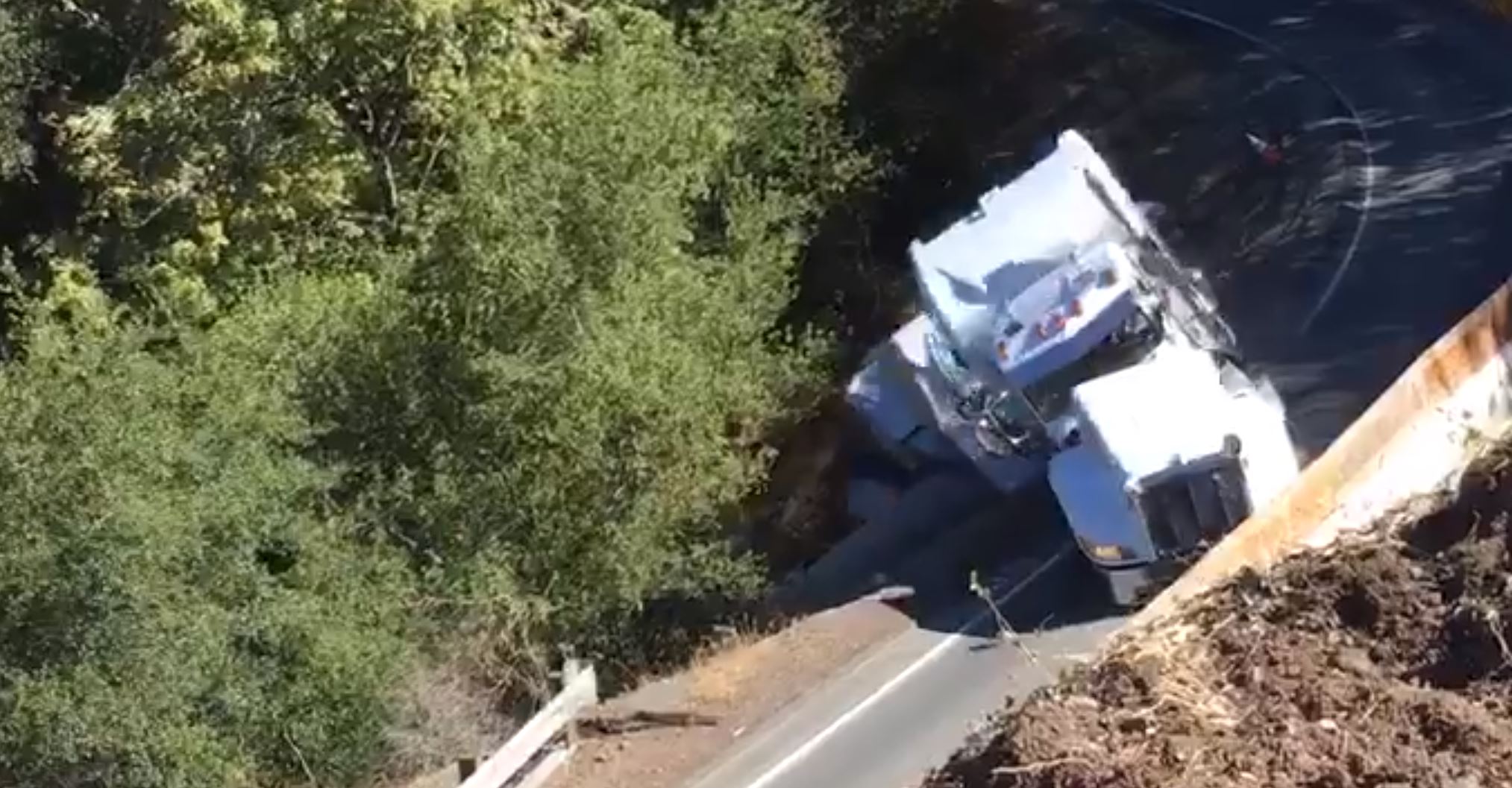 Ouch! This Big Rig Misses The Mark BAD! Watch This Mistake End In A Huge Slide Down A Hill