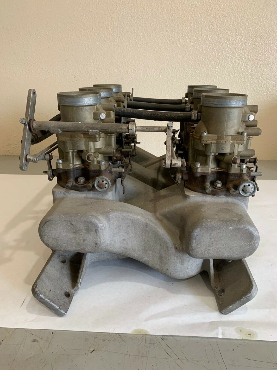 BangShift.com 1960s Edelbrock Intake Manifold Plunks Six Ford 2-BBL Carbs