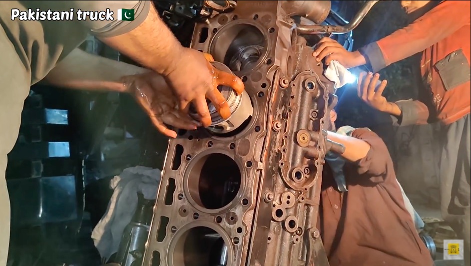 Taking It To The Street: Watch These Pakistani Truck Mechanics Rebuild A Massive Diesel V8 On The Side Of The Street