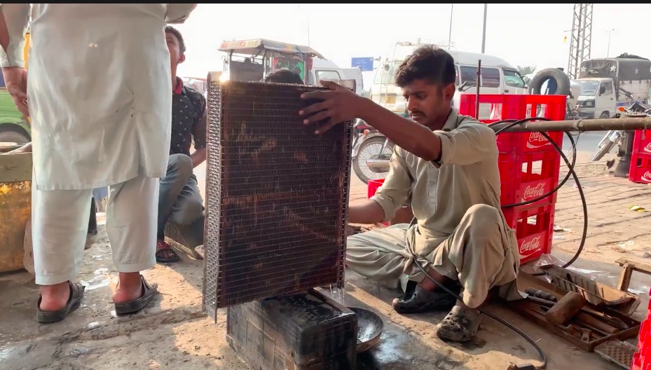 Roadside Magic: Watch These Young Guys Craft A Fresh Radiator Out Of Pieces From An Old One